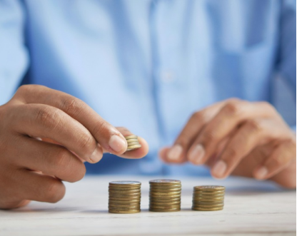 person stacking coins